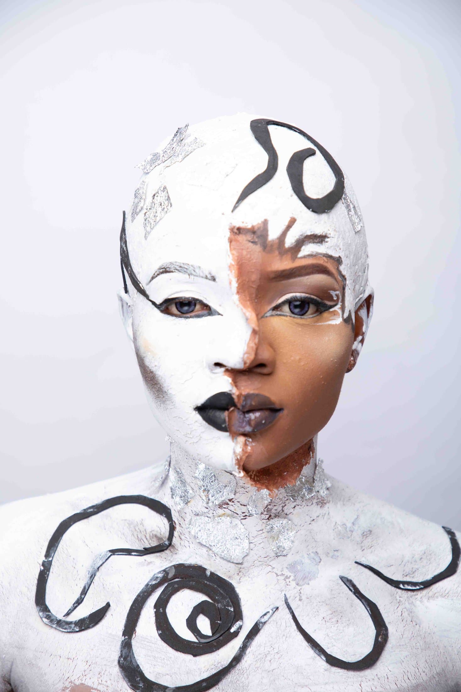 Porcelain-cracked white mask split to reveal living skin, eyes to camera
